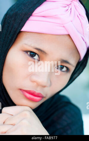 Portrait of young Asian Islamic woman wearing hijab on location, Cebu, Philippines Stock Photo