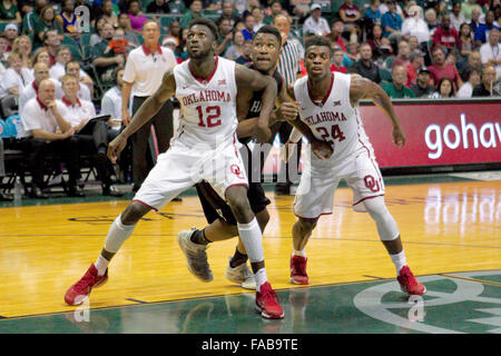 Honolulu, Hawaii, USA.  25th December, 2015. Oklahoma Sooners forward Khadeem Lattin (12) attempts to get the rebound during the action between the Harvard Crimson and the Oklahoma Sooners at the 2015 Diamond Head Classic at Stan Sheriff Center in Honolulu, HI. Credit:  Cal Sport Media/Alamy Live News Stock Photo