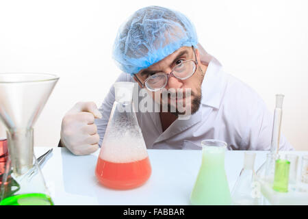 Mad chemist in the lab doing reaction Stock Photo