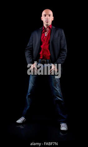 young man in a red shirt and black suit Stock Photo