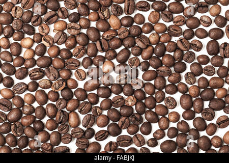 Dark roasted coffee beans pattern on white background Stock Photo