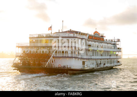 The historical San Francisco Belle paddlewheel boat in San Francisco Bay, California, USA in the pink light of sunset Stock Photo