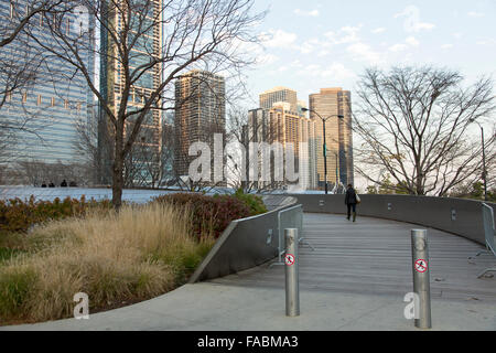 BP Pedestrian Bridge linking Maggie Daley Park with Millennium Park in Chicago, Illinois, USA with city skyline in the background Stock Photo