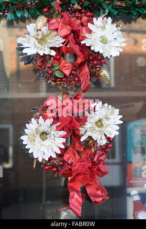 A Christmas Wreath on a window Stock Photo