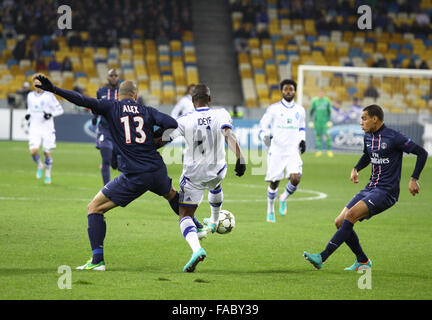 KYIV, UKRAINE - NOVEMBER 21, 2012: Alex of FC Paris Saint-Germain (L) fights for a ball with Brown Ideye of FC Dynamo Kyiv (C) during their UEFA Champions League game on November 21, 2012 in Kyiv, Ukraine Stock Photo