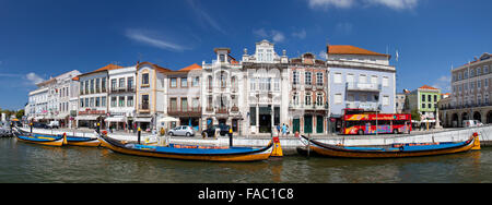AVEIRO, PORTUGAL - AUGUST 26, 2014: Moliceiro boat sail along the central canal in Aveiro, Portugal Stock Photo