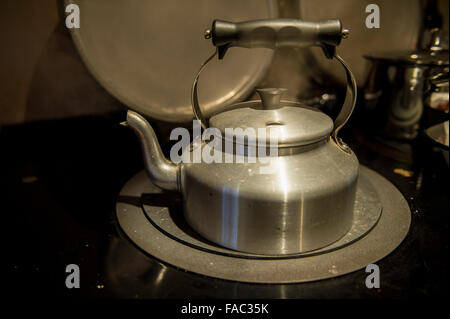 A kettle boils on an aga Stock Photo