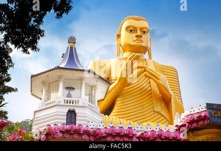 Sri Lanka - Dambulla, Golden Buddha statue over the Buddish Museum, UNESCO World Heritage Site Stock Photo