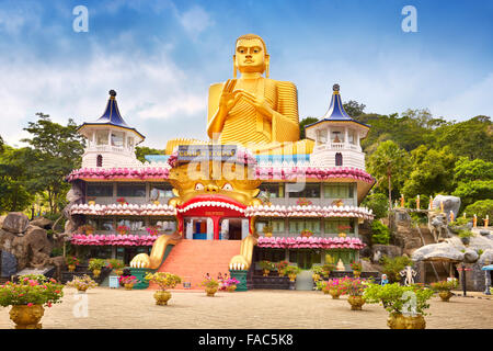 Sri Lanka - Dambulla, Golden Buddha statue over the Buddish Museum, UNESCO World Heritage Site Stock Photo