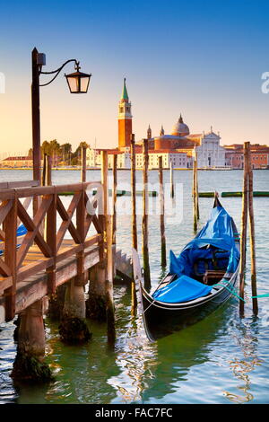 Venice Grand Canal - venetian gondola moored to molo San Marco, Venice, Italy Stock Photo