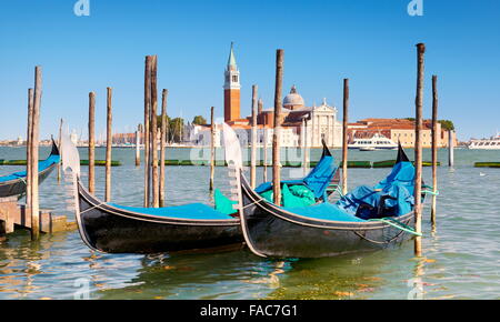 Venice, Italy - venetian gondola on Grande Canal (Grand Canal) and San Giorgio Maggiore church in the background, UNESCO Stock Photo