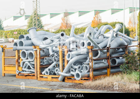 Flanged steel pipes, already bent fit to be mounted on a plant. Stock Photo