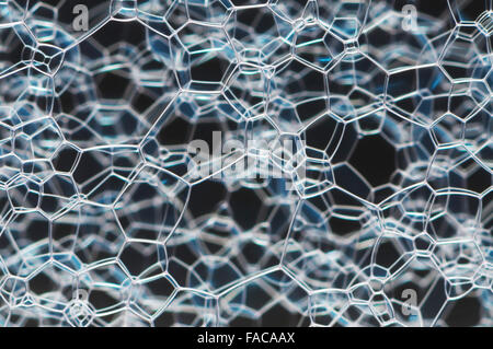 Fine white pattern over a black and blue blurred background Stock Photo