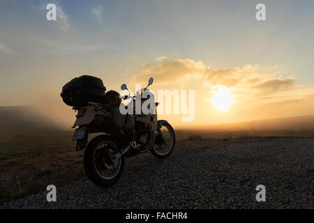 Motorcycle parked on the street, midnight sun, North Cape, Magerøya, Finnmark County, Norway Stock Photo