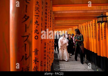 First Lady Michelle Obama walks through the torii gates during a tour of the Fushimi Inari Shinto Shrine March 20, 2015 in Kyoto, Japan. Stock Photo