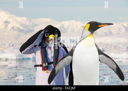 Crew members of an expedition cruise to Antarctica in a Zodiak in Fournier Bay in the Gerlache Strait on the Antarctic Peninsula Stock Photo