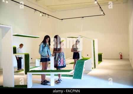 US First Lady Michelle Obama, daughters Malia, Sasha and mother Marian Robinson tour an exhibit at the La Biennale June 20, 2015 in Venice, Italy. Stock Photo