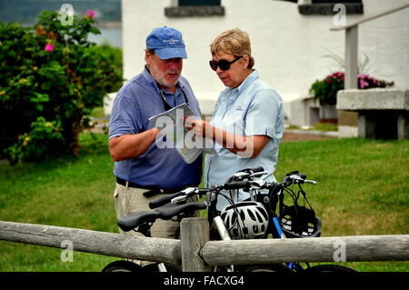 Jamestown, Rhode Island:  Man and woman next to their parked bicycles study a road map at 1856 Beavertail Light House State Park Stock Photo