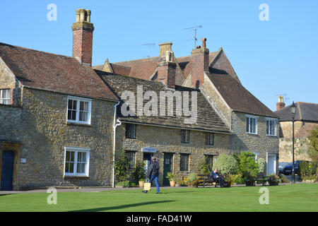 Sherborne Abbey Shop and old cottages on the green, Sherborne, Dorset, England Stock Photo