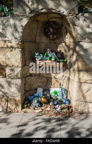 The very unique and fanciful 'frog shrine' located on a low rock wall on Paterna Road in Santa Barbara's Riviera neighborhood. Stock Photo