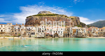 Medieval houses and La Rocca hill, panoramic view, Cefalu old town,  Sicily, Italy Stock Photo