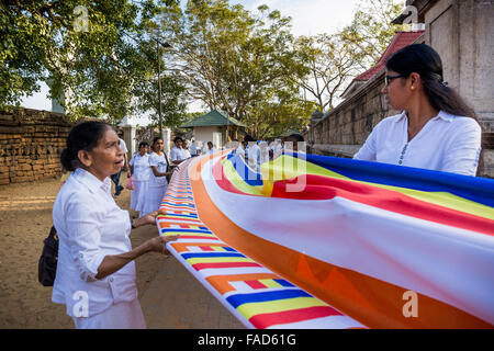 People praying at Sri Maha Bodhi (sacred bodhi tree), Anuradhapura, North Central Province, Sri Lanka,  UNESCO world heritage Stock Photo