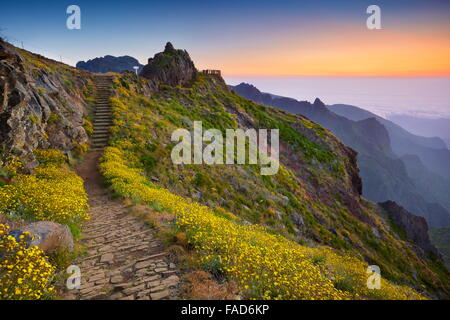 Mountain hiking trail from Pico do Arieiro to Pico Ruivo before sunrise, Madeira Island, Portugal