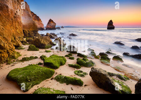 Algarve coast at sunrise near Lagos, Algarve, Portugal Stock Photo