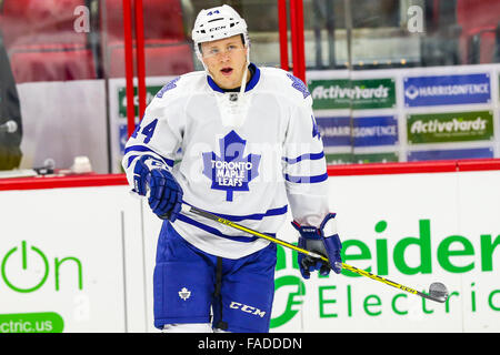 Toronto Maple Leafs' Morgan Rielly gets tangled up in the legs of ...