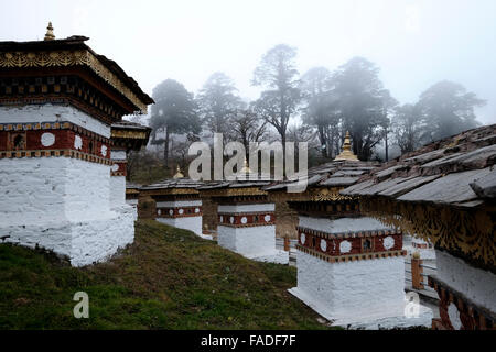 View of 108 Stupas chortens which were constructed as a memorial to the victory of the Bhutanese army in the 2003 war of Southern Bhutan located at Dochula pass on the way to Punakha from Thimphu in Bhutan Stock Photo