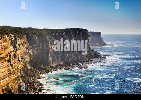 view from elevated lookout from north head in Sydney, Australia, towards rugged rocky coast on a sunny summer day