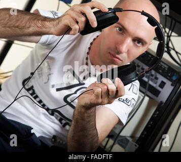 The person in headphones listens to music Stock Photo