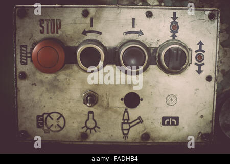 Color image of some buttons on a dirty old control panel. Stock Photo