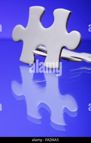 Two jigsaw puzzle parts joined together Stock Photo