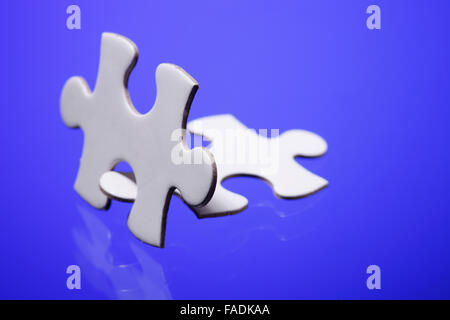 Two jigsaw puzzle parts joined together Stock Photo