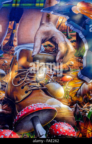 Urban wall art portraying someone picking mushrooms in a forest, Glasgow, Scotland, UK Stock Photo