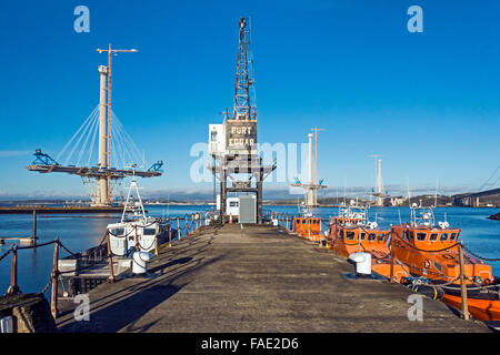 Progress building Queensferry Crossing road bridge from South to North Queensferry in central Scotland & old Forth Road Bridge Stock Photo