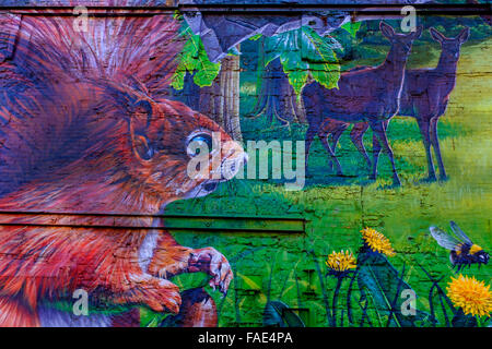 Urban art painted on an outside wall of a squirrel and two deer, Glasgow, Scotland, UK Stock Photo
