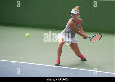 Female tennis player preparing to hit her backhand. Stock Photo