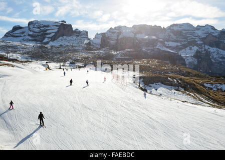 The ski slope and skiers at Passo Groste ski area, Madonna di Campiglio, Italy Stock Photo