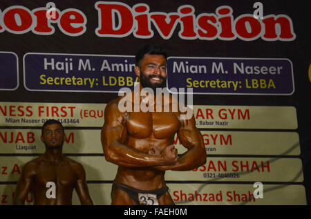 Lahore, Pakistan. 28th Dec, 2015. Pakistani body builders posing during Mr. Lahore & Junior Mr. Lahore body building competition organised by Lahore body building association & Pakistan bodybuilding federation in local hotel Lahore. © Rana Sajid Hussain/Pacific Press/Alamy Live News Stock Photo