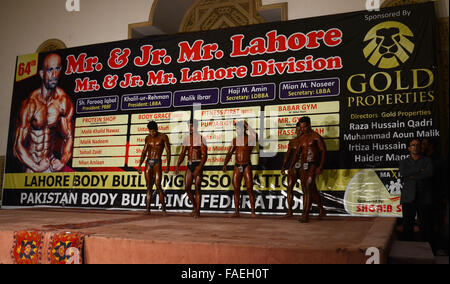 Lahore, Pakistan. 28th Dec, 2015. Pakistani body builders posing during Mr. Lahore & Junior Mr. Lahore body building competition organised by Lahore body building association & Pakistan bodybuilding federation in local hotel Lahore. © Rana Sajid Hussain/Pacific Press/Alamy Live News Stock Photo