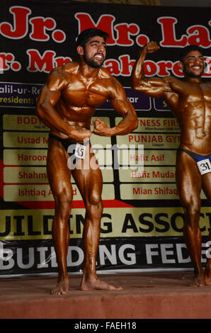 Lahore, Pakistan. 28th Dec, 2015. Pakistani body builders posing during Mr. Lahore & Junior Mr. Lahore body building competition organised by Lahore body building association & Pakistan bodybuilding federation in local hotel Lahore. © Rana Sajid Hussain/Pacific Press/Alamy Live News Stock Photo