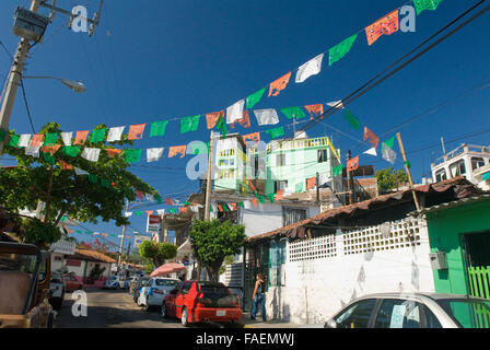 Colorful flags and banners above streets of Acapulco, Mexico Stock Photo