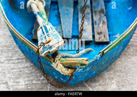 Old blue wooden shabby fishing boat detail. Shot with a selective focus Stock Photo