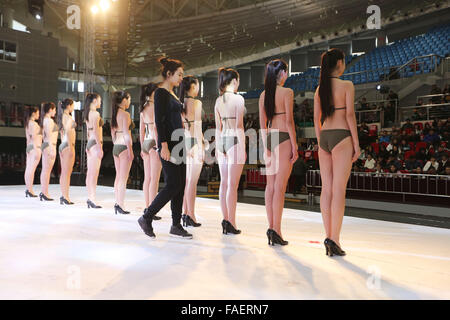 Qingdao, China. 29th Dec, 2015. Candidates attend an audition for model & flight attendant in Qingdao, east China's Shandong Province, Dec. 28, 2015. A professional audition for model & flight attendant facing national high schools was held here on Monday, attracting more than 1,000 high school graduates from across the country. Credit:  Xinhua/Alamy Live News Stock Photo