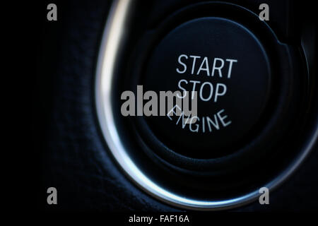 Detail on a black start button in a car. Stock Photo