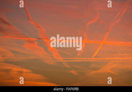 Frankfurt am Main, Germany. 29th Dec, 2015. Aeroplane trails at sunrise in the sky over Frankfurt am Main, Germany, 29 December 2015.  Credit:  FRANK RUMPENHORST/dpa picture alliance/Alamy Live News Stock Photo