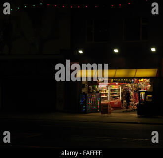 Night view electric lights shop selling novelties, toys, balls, Carousel Arcade, Central Promenade, Blackpool Illuminations, UK Stock Photo