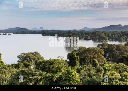 View of Kandalama Lake with Sigiriya Rock in distance. Taken at Heritance Kandalama Hotel near Dambulla, Sri Lanka Stock Photo